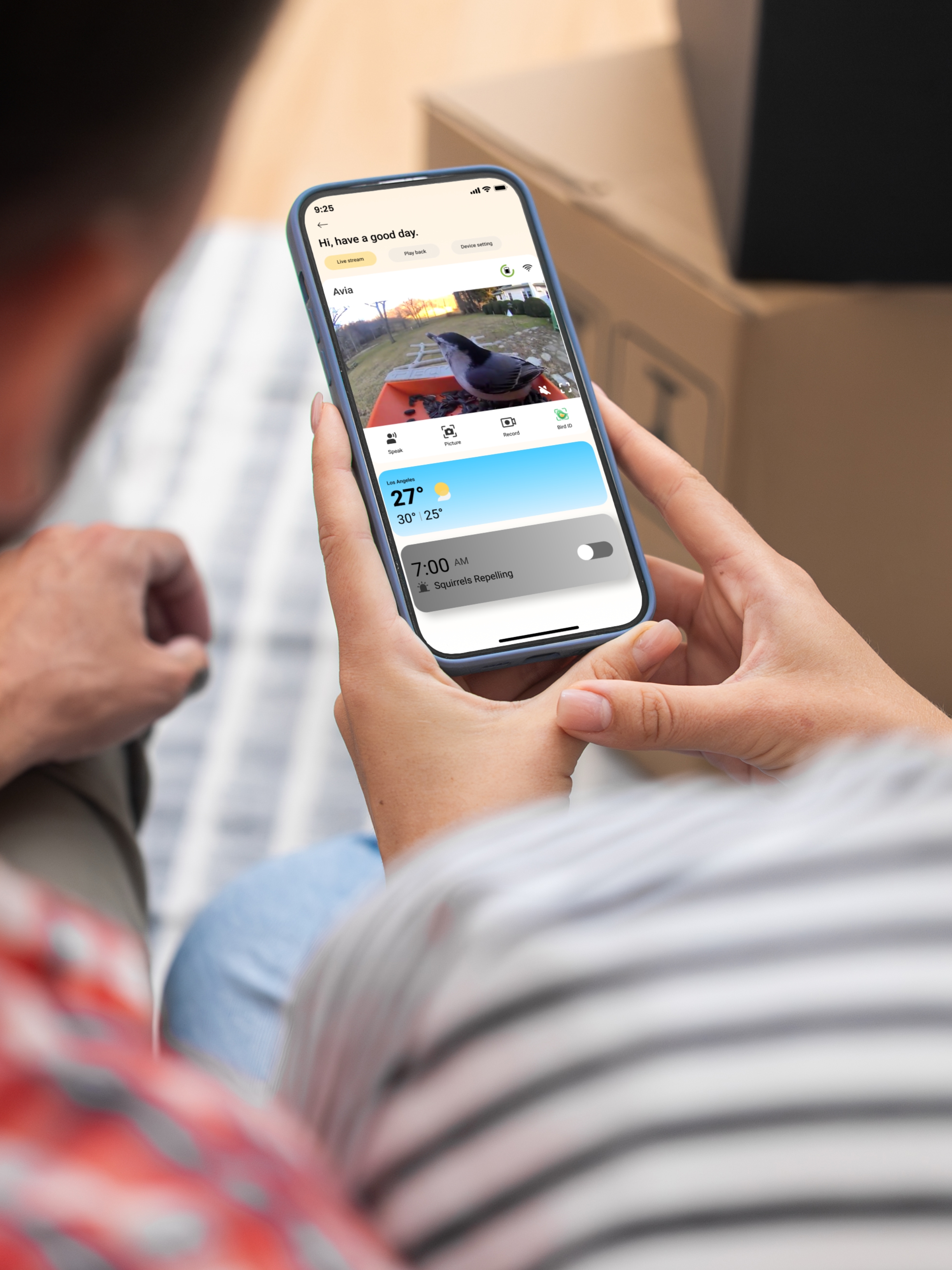 Parents sharing bird watching moment together